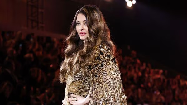 Aishwarya Rai Bachchan presents a creation during a public show named 'Walk Your Worth' organised by French cosmetics group L'Oreal near the Eiffel Tower as part of Paris Fashion Week, in Paris, France (Photo: Reuters)