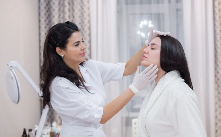 Plastic surgeon consulting patient at aesthetic clinic in Bangalore