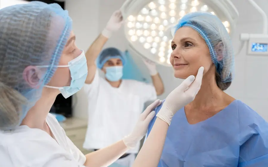 Doctor examining patient during cosmetic surgery consultation in Bangalore