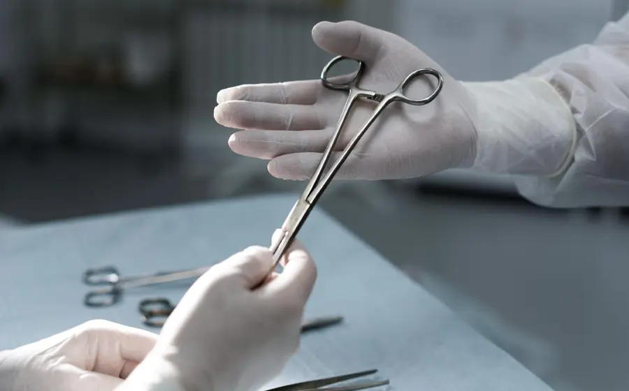 Sterile surgical instruments being prepared in OT for liposuction procedure