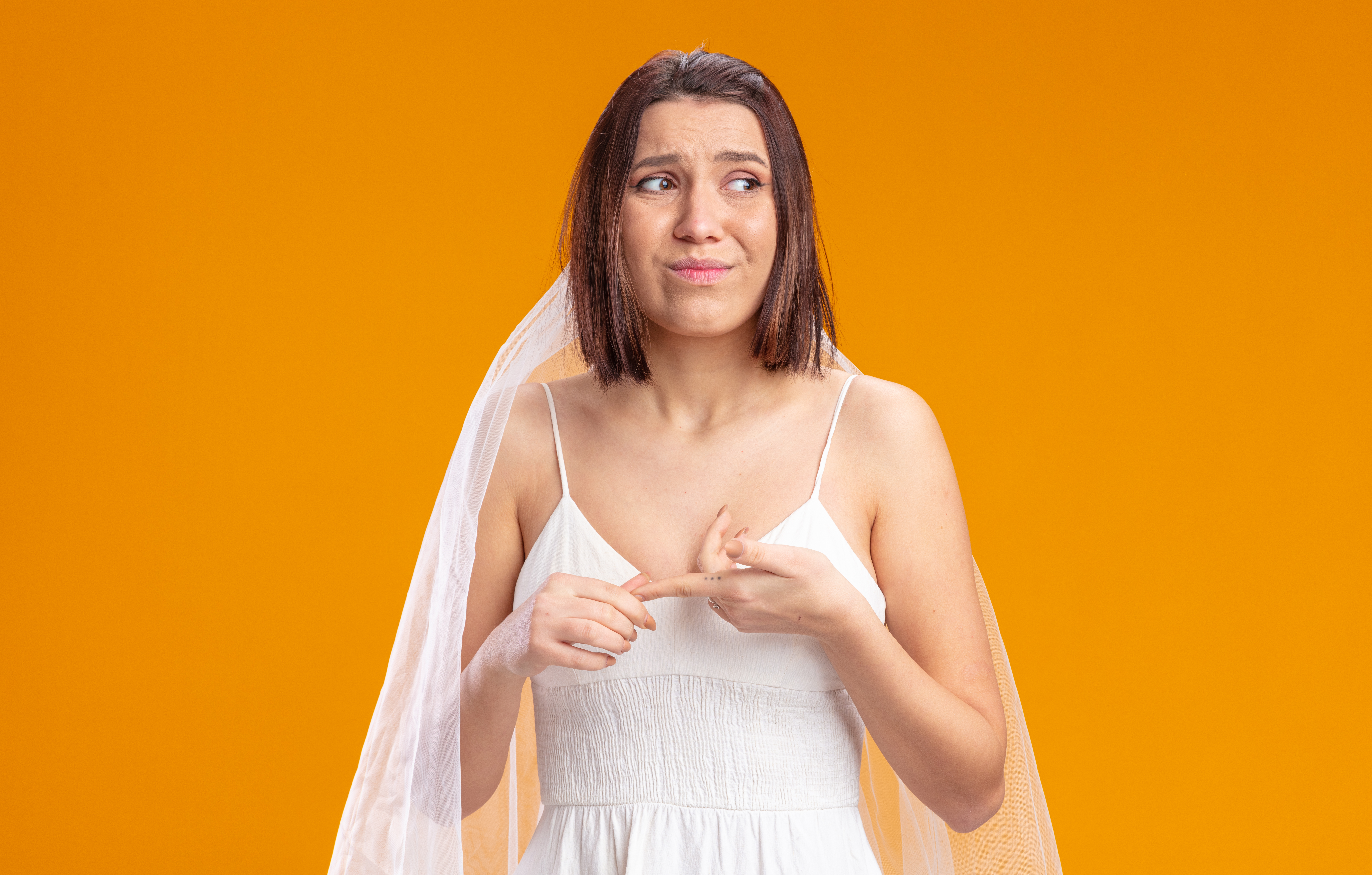 bride beautiful wedding dress looking aside confused very