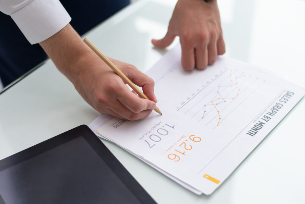 0.5 mL vs 1 mL Lip Fillers: Which Amount is Right for You? 4 close up male hands writing sales report office