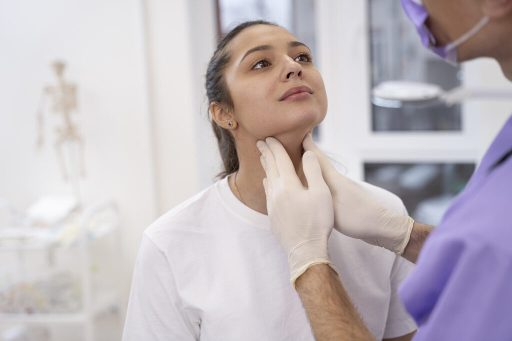 Kybella vs Liposuction: Which Works Better for Double Chin? 3 doctor performing routine medical checkup 1