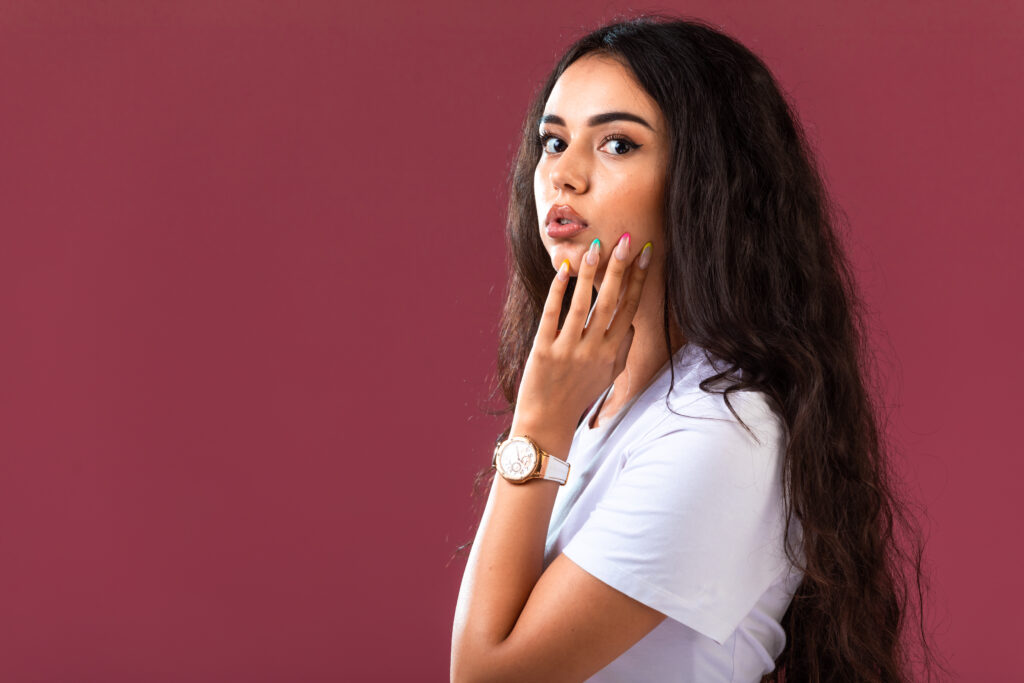 female model posing pink wall 1