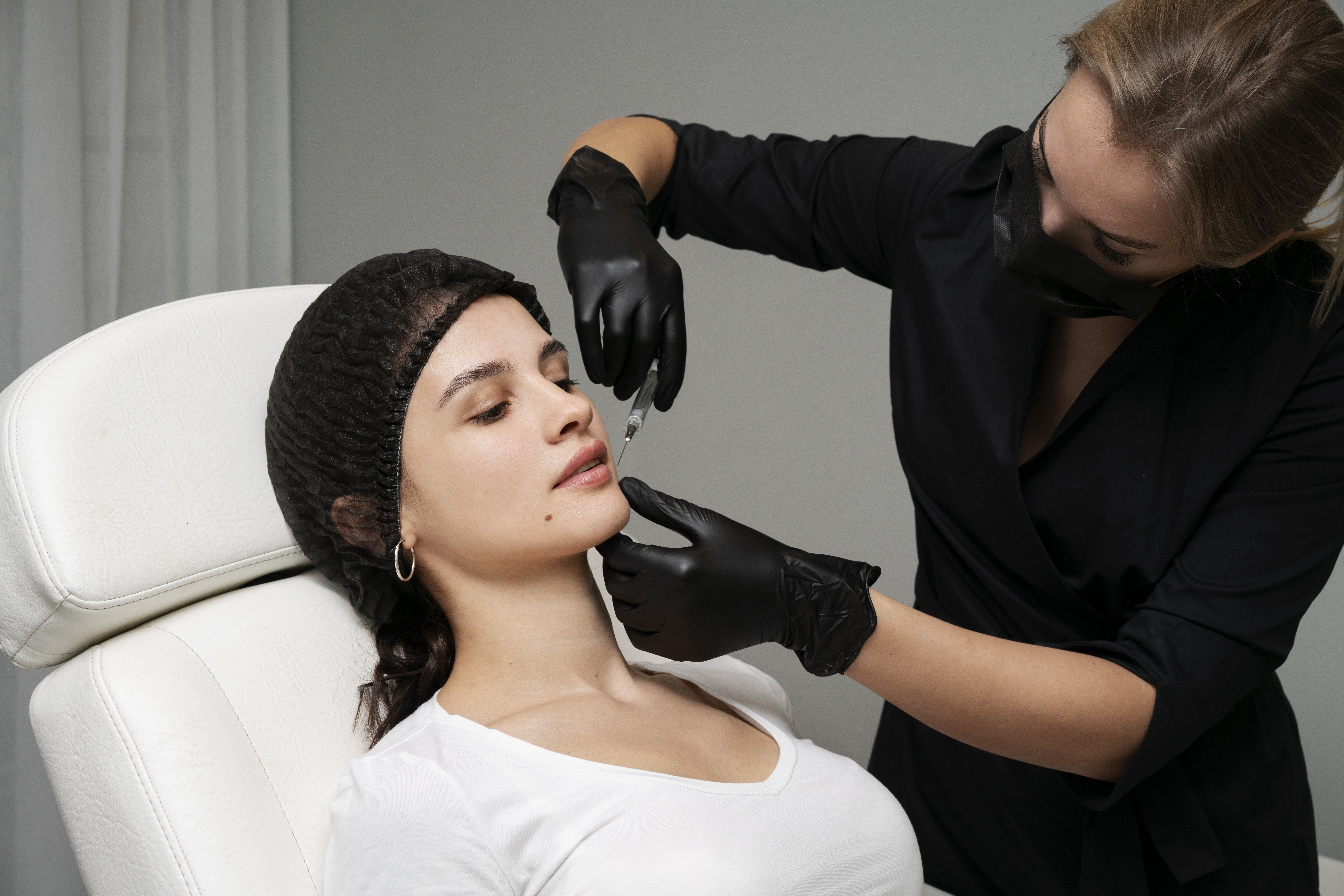 Lip Fillers at Different Ages: When is the Right Time? 2 medium shot woman getting lip fillers clinic
