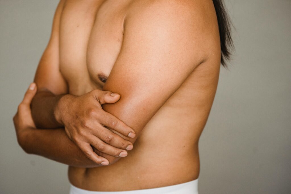 Top 5 Causes of “Man Boobs” in Men Over 30 in Bangalore 1 pexels armin rimoldi 5301583