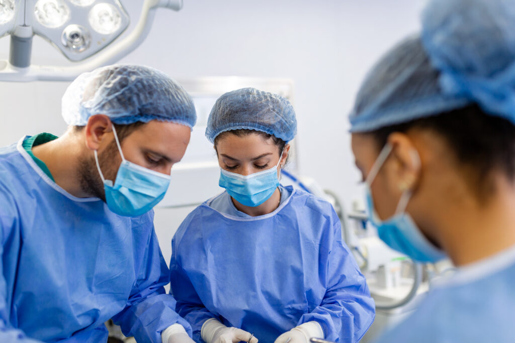 shot team surgeons performing surgery operating theatre