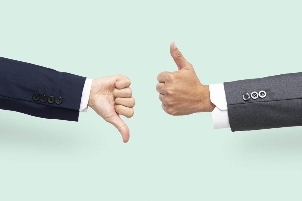 Kybella vs Liposuction: Which Works Better for Double Chin? 4 thumbs up down hands agree disagree gesture