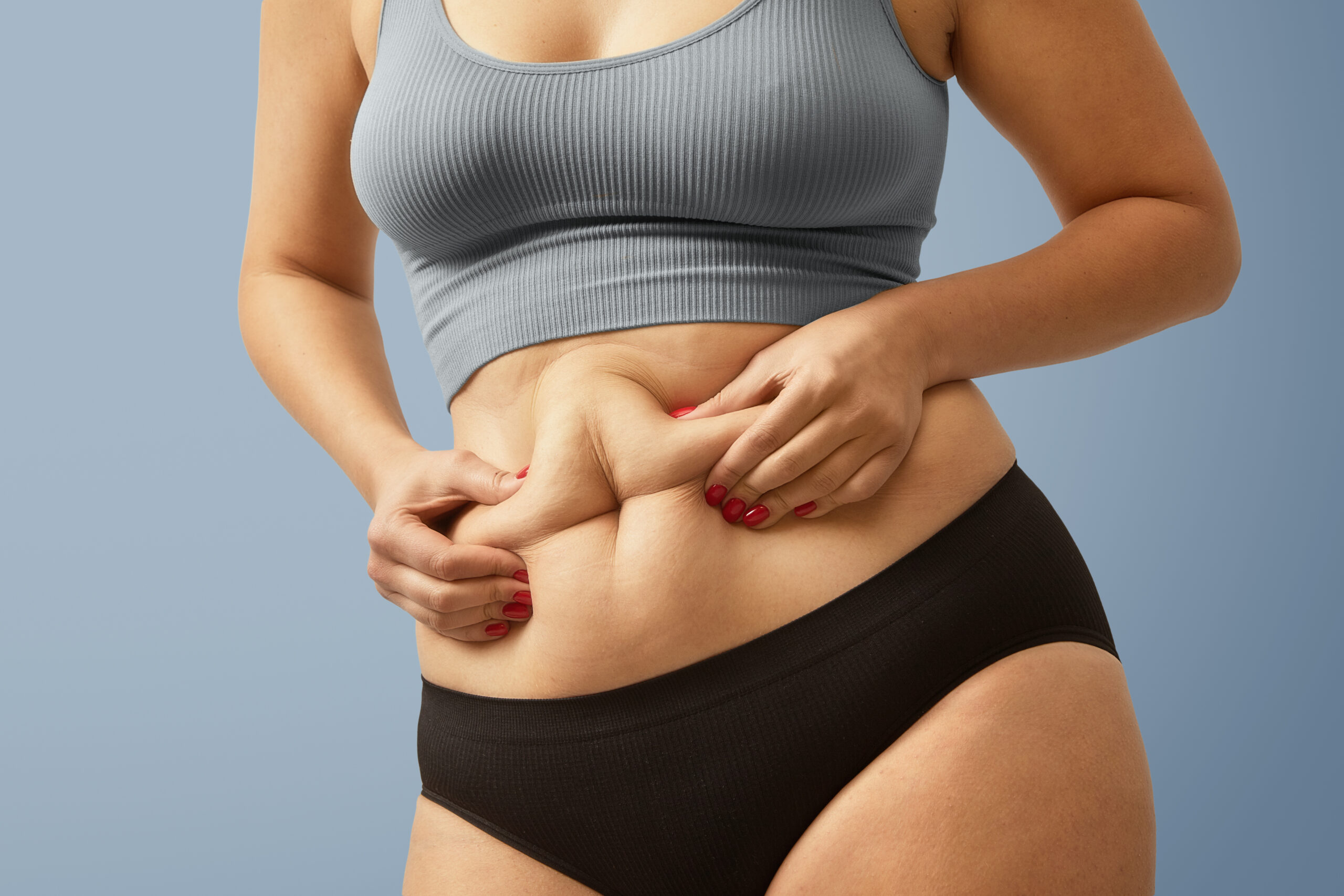 woman body fat belly obese woman hands holding excessive tummy fat change diet lifestyle concept shape up healthy stomach muscle studio anonymous shot photo body parts 1 scaled