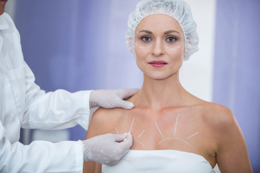 doctor marking female patients body breast surgery 2.jpg